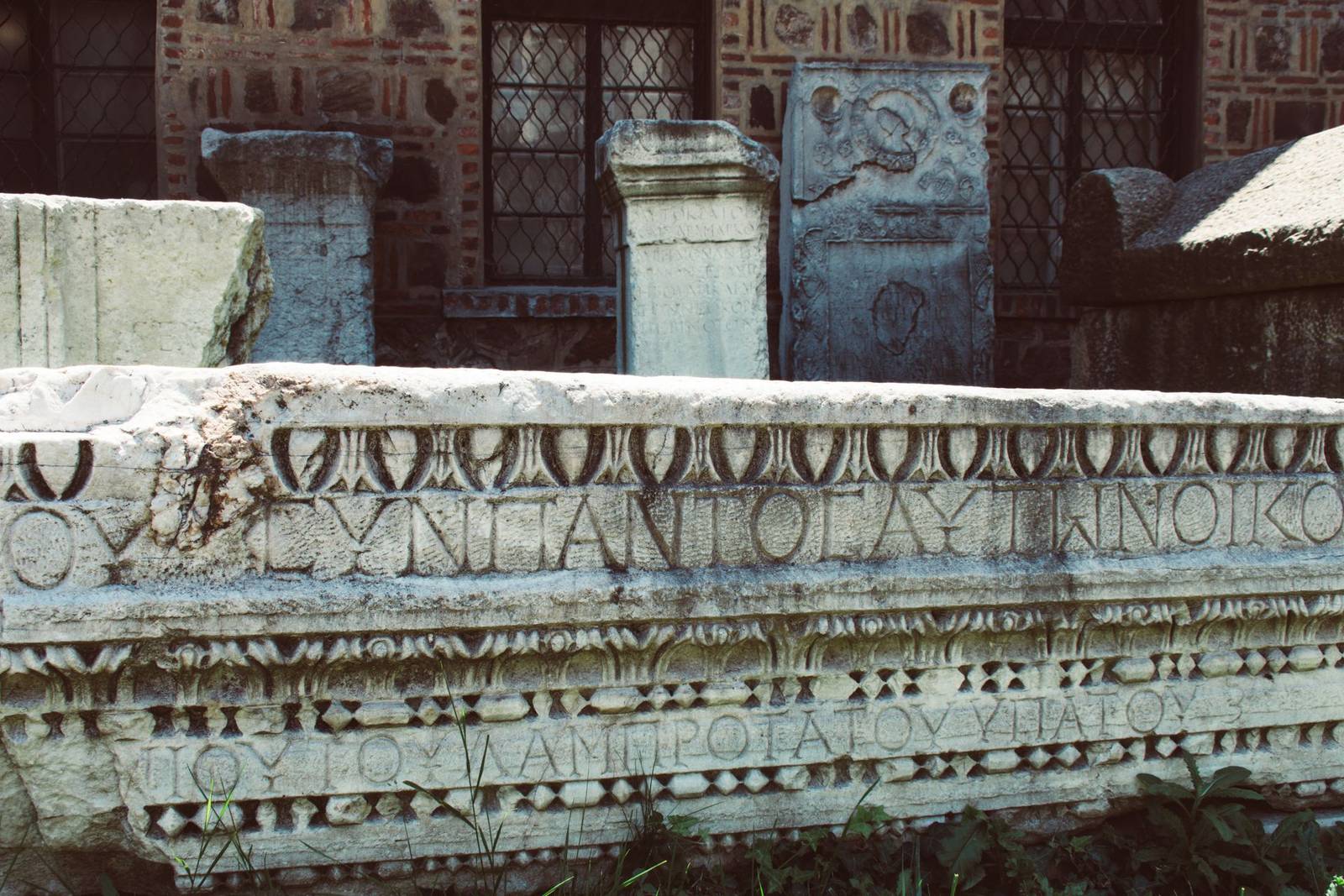 Carved marble frieze with a line of ancient inscription