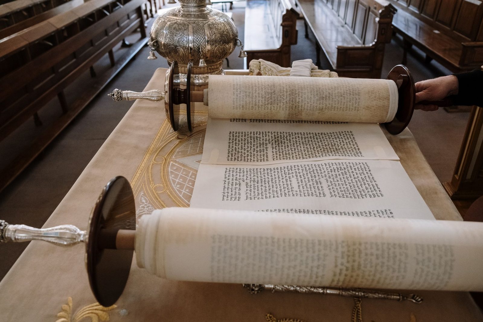 Open Torah scroll on a reading table in a synagogue
